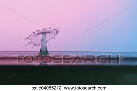 Two water drops colliding and forming a columnar structure View Large Photo Image Stock Image - Two water drops colliding and forming a columnar structure. Fotosearch