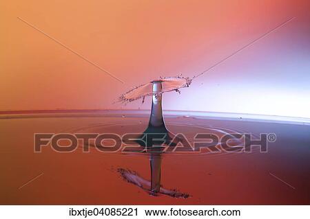 Two water drops colliding and forming a columnar structure View Large Photo Image Stock Image - Two water drops colliding and forming a columnar structure. Fotosearch