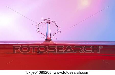 Two water drops colliding and forming a columnar structure View Large Photo Image Stock Photograph - Two water drops colliding and forming a columnar structure. Fotosearch