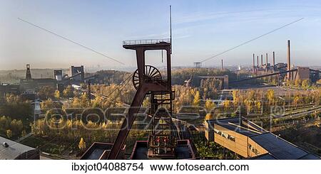 Picture - UNESCO World Heritage Site, Zeche Zollverein, view on headframe shaft 1, on the left double shaft 12, right the coking plant, Essen, North Rhine-Westphalia, Germany, Europe. Fotosearch