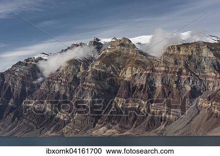 Stock Image - Unfolded coloured rock strata, former marine sediments, Berzelius Bjerg, Segelsallskapet or Segelselskapets Fjord, Northeast Greenland National Park, Greenland, North America. Fotosearch
