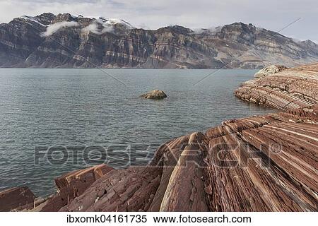 Unfolded coloured rock strata, former marine sediments, Berzelius Bjerg, Segelsallskapet or Segelselskapets Fjord, Northeast Greenland National Park, Greenland, North America View Large Photo Image Stock Photography - Unfolded coloured rock strata, former marine sediments, Berzelius Bjerg, Segelsallskapet or Segelselskapets Fjord, Northeast Greenland National Park, Greenland, North America. Fotosearch