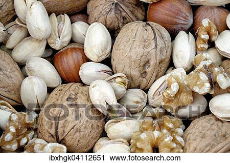 Stock Image - Various nuts, walnuts, hazelnuts, pistachios. Fotosearch