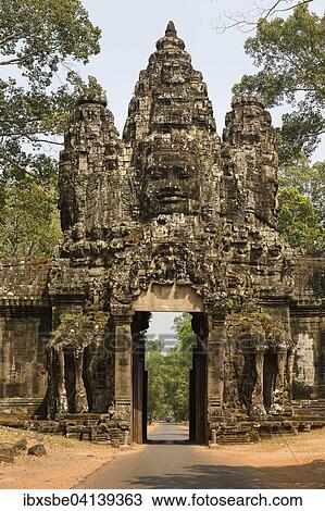 Victory Gate in the east of Angkor Thom, Avalokiteshvara face tower, western view, Angkor Thom, Siem Reap, Cambodia, Asia View Large Photo Image Stock Image - Victory Gate in the east of Angkor Thom, Avalokiteshvara face tower, western view, Angkor Thom, Siem Reap, Cambodia, Asia. Fotosearch