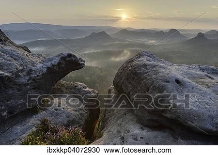 Stock Image - View from Kleiner Winterberg mountain at sunrise, Elbe Sandstone Mountains, Saxon Switzerland, Saxony, Germany, Europe. Fotosearch