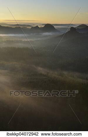 Stock Image - View from Kleiner Winterberg mountain at dawn, Elbe Sandstone Mountains, Saxon Switzerland, Saxony, Germany, Europe. Fotosearch