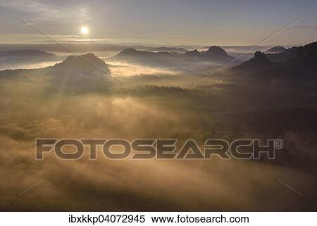 Stock Photography - View from Kleiner Winterberg mountain at sunrise, Elbe Sandstone Mountains, Saxon Switzerland, Saxony, Germany, Europe. Fotosearch