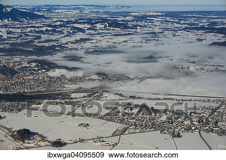 Stock Photo - View from Tegelberg massif of the town of Fussen, Schwangau, Waltenhofen and Forggensee lake, Ostallgau, Allgau, Swabia, Bavaria, Germany, Europe. Fotosearch