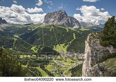 Stock Image - View from the Stevia Massif, Puez Group, Puez-Geisler Nature Park, in the valley the village of Wolkenstein or Selva di Val Gardena, Selva di Val Gardena, at the back Mt Langkofel, 3181 m, Dolomites, South Tyrol, Italy, Europe. Fotosearch
