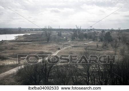 Stock Image - View of a contaminated area from a train that takes the workers of Slavutych to Chernobyl through a stretch of Belarussian territory, in Chernobyl they dismantle the reactor and build the so-called ark, Ukraine, Europe. Fotosearch