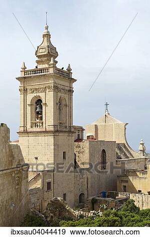 View of the Catholic Cathedral with with a large church tower in the Citadel, Cittadella, Victoria, Rabat, Gozo, Malta, Europe View Large Photo Image Stock Photo - View of the Catholic Cathedral with with a large church tower in the Citadel, Cittadella, Victoria, Rabat, Gozo, Malta, Europe. Fotosearch