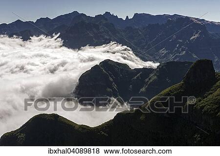 View of the mountains of the Parque Natural da Madeira, Passat clouds are stopped by the mountain slopes, Madeira, Portugal, Europe View Large Photo Image Stock Photo - View of the mountains of the Parque Natural da Madeira, Passat clouds are stopped by the mountain slopes, Madeira, Portugal, Europe. Fotosearch