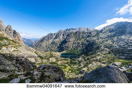 Stock Photo - View on the mountain lake Lac de Capitello with surroundings, Restonica high valley, Corte, Haute-Corse, Corsica, France, Europe. Fotosearch