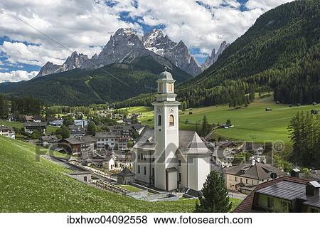 Stock Photo - Village of Sexten or Sesto, Sextental or Valle di Sesto, Sexten Dolomites at the back, Sexten, Sesto, South Tyrol, Italy, Europe. Fotosearch