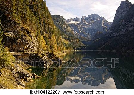 Stock Photo - Vorderer Gosausee lake, Dachstein behind, Dachstein Mountains, Gosau, Salzkammergut, Upper Austria, Austria, Europe. Fotosearch