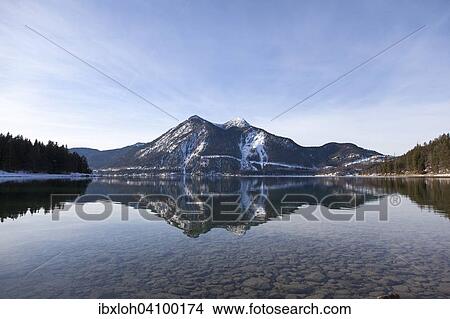 Picture - Walchensee or Lake Walchen and Herzogstand mountain in winter, Kochel am See, Jachenau, Upper Bavaria, Bavaria, Germany, Europe. Fotosearch