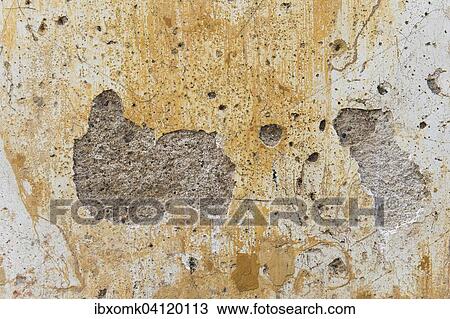 Wall with holes, plaster and traces of yellow paint, Kerala, India, Asia View Large Photo Image Stock Image - Wall with holes, plaster and traces of yellow paint, Kerala, India, Asia. Fotosearch