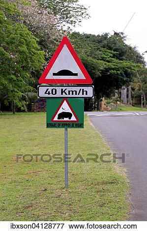 Stock Photo - Warning sign, hippos crosssing, Saint Lucia, iSimangaliso Wetland Park, Kwa Zulu Natal, South Africa, Africa. Fotosearch