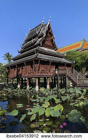 Wat Thung Si Mueang, monastery library, wooden temple, lotus pond, Muang, Ubon Ratchathani, Isan, Isaan, Thailand, Asia View Large Photo Image Stock Image - Wat Thung Si Mueang, monastery library, wooden temple, lotus pond, Muang, Ubon Ratchathani, Isan, Isaan, Thailand, Asia. Fotosearch