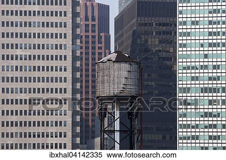 Water tank in front of skyscrapers in Lower Manhattan, New York, USA View Large Photo Image Stock Photography - Water tank in front of skyscrapers in Lower Manhattan, New York, USA. Fotosearch