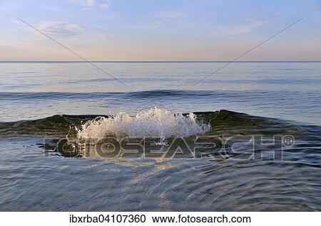 Stock Image - Waves at Baltic Sea, evening light, Mecklenburg-Western Pomerania, Germany, Europe. Fotosearch