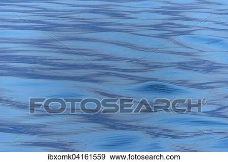 Stock Photo - Waves in the evening light, sea, Denmark Strait, Greenland, North America. Fotosearch