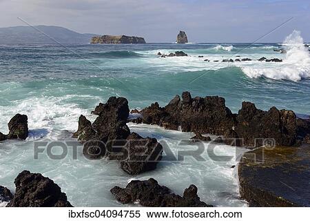 Stock Photography - Waves, surf, views of the islands Deitado and Em Pe, Areia Funda, Pico Island, Azores, Portugal, Europe. Fotosearch