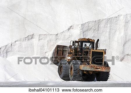 Stock Image - Wheel loader, sea salt production at Walvis Bay, Namibia, Africa. Fotosearch