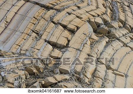 Stock Photo - Whitish-yellow dolomite, marine sediment, Segelsallskapet Fjord, Northeast Greenland National Park, Greenland, North America. Fotosearch
