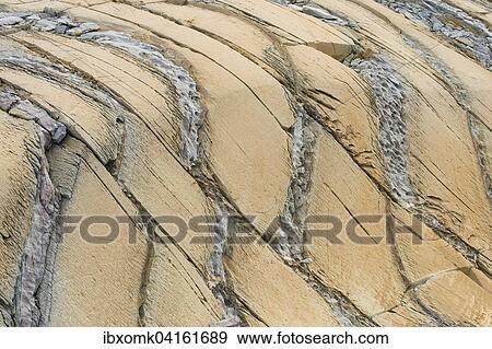 Stock Photo - Whitish-yellow dolomite, marine sediment, Segelsallskapet Fjord, Northeast Greenland National Park, Greenland, North America. Fotosearch