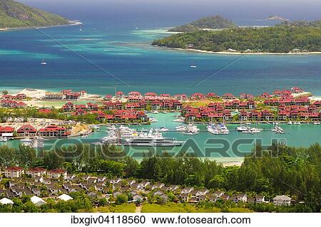 Yachts in the marina of Eden Island, Ile au Cerf island at the back, Victoria, Mahe Island, Seychelles, Africa View Large Photo Image Stock Image - Yachts in the marina of Eden Island, Ile au Cerf island at the back, Victoria, Mahe Island, Seychelles, Africa. Fotosearch