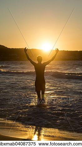 Young man, silhouette, on the beach at sunset, sunset by the sea, Haute-Corse, Corsica, France, Europe View Large Photo Image Stock Photography - Young man, silhouette, on the beach at sunset, sunset by the sea, Haute-Corse, Corsica, France, Europe. Fotosearch