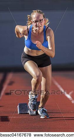 Young woman, 18 years, sprint start View Large Photo Image Stock Photo - Young woman, 18 years, sprint start. Fotosearch