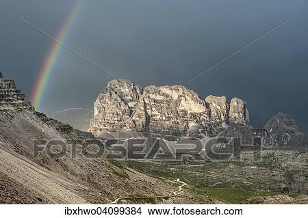 Zwolferkofel with rainbow, view from the Tre Cime di Lavaredo area, Sexten Dolomites, Province of South Tyrol, Italy, Europe View Large Photo Image Picture - Zwolferkofel with rainbow, view from the Tre Cime di Lavaredo area, Sexten Dolomites, Province of South Tyrol, Italy, Europe. Fotosearch