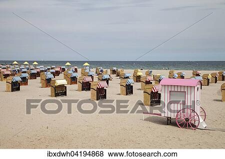 Beach chairs on the sandy beach, Travemunde, Lubeck, Schleswig-Holstein, Germany, Europe View Large Photo Image Stock Photo - Beach chairs on the sandy beach, Travemunde, Lubeck, Schleswig-Holstein, Germany, Europe. Fotosearch