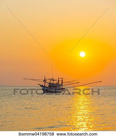 Boat in the sea at sunset in front of small islands, Koh Samui, Gulf of Thailand, Thailand, Asia View Large Photo Image Stock Photo - Boat in the sea at sunset in front of small islands, Koh Samui, Gulf of Thailand, Thailand, Asia. Fotosearch