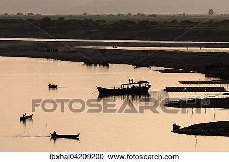 Boats, riverbank of Irrawaddy or Ayeyarwaddy, sunset, evening light, Bagan, Mandalay region, Myanmar, Asia View Large Photo Image Stock Image - Boats, riverbank of Irrawaddy or Ayeyarwaddy, sunset, evening light, Bagan, Mandalay region, Myanmar, Asia. Fotosearch