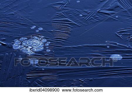 Stock Image - Bubbles and structure in ice. Fotosearch