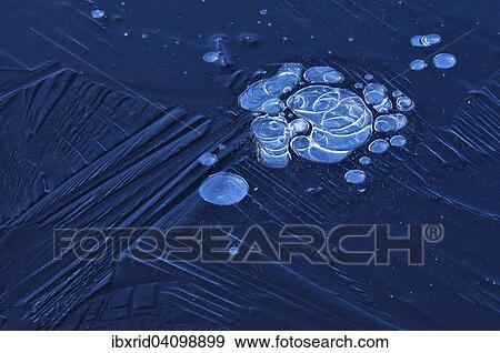 Stock Photo - Bubbles and structure in ice. Fotosearch