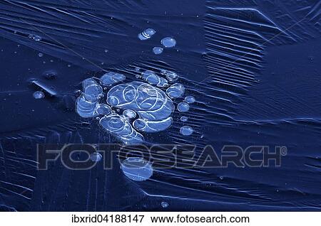 Stock Photo - Bubbles and structure in ice. Fotosearch