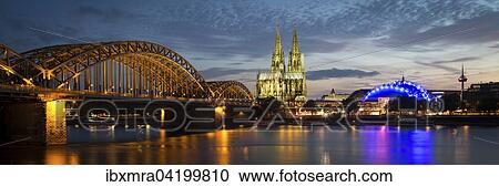 City-panorama of Cologne at dusk, Rhine, Hohenzollern Bridge, cathedral, the Musical Dome, Colonius TV tower, Cologne, North Rhine-Westphalia, Germany, Europe View Large Photo Image Stock Image - City-panorama of Cologne at dusk, Rhine, Hohenzollern Bridge, cathedral, the Musical Dome, Colonius TV tower, Cologne, North Rhine-Westphalia, Germany, Europe. Fotosearch