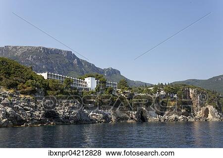 Stock Photo - Cliffs with Akrotiri Beach Hotel, Paleokastrista, island Corfu, Ionian Islands, Greece, Europe. Fotosearch