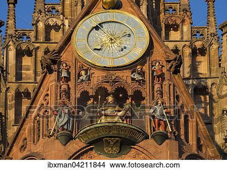 Picture - Clock and figurines, Mannleinlaufen, Church of Our Lady, Sebalder Altstadt, Nuremberg, Middle Franconia, Franconia, Bavaria, Germany, Europe. Fotosearch