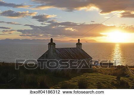 Evening view, short before sunset, Isle of Skye on a single track road with an old Scottish stone house, Melvaig, Gairloch, Western Ross, Scotland, United Kingdom, Europe View Large Photo Image Stock Image - Evening view, short before sunset, Isle of Skye on a single track road with an old Scottish stone house, Melvaig, Gairloch, Western Ross, Scotland, United Kingdom, Europe. Fotosearch