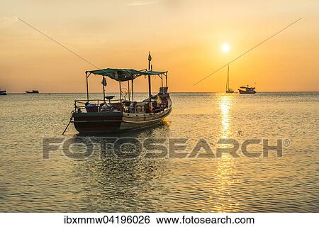 Stock Photograph - Fishing boat in the sea at sunset, Koh Tao island, Gulf of Thailand, Thailand, Asia. Fotosearch