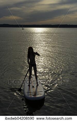 Girl, stand up paddle boarding, SUP, sundown, St. Heinrich, Starnberger See, Fuenfseenland, Upper Bavaria, Bavaria, Germany, Europe View Large Photo Image Stock Image - Girl, stand up paddle boarding, SUP, sundown, St. Heinrich, Starnberger See, Fuenfseenland, Upper Bavaria, Bavaria, Germany, Europe. Fotosearch