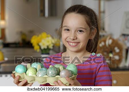 Girl with coloured Easter eggs for the Easter basket, Easter, Upper Bavaria, Bavaria, Germany, Europe View Large Photo Image Stock Photography - Girl with coloured Easter eggs for the Easter basket, Easter, Upper Bavaria, Bavaria, Germany, Europe. Fotosearch