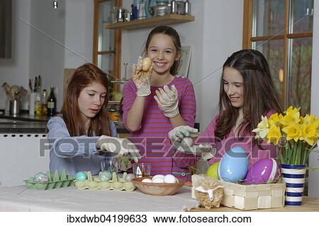 Girls colouring Easter eggs for Easter, Upper Bavaria, Bavaria, Germany, Europe View Large Photo Image Stock Image - Girls colouring Easter eggs for Easter, Upper Bavaria, Bavaria, Germany, Europe. Fotosearch
