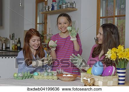 Girls colouring Easter eggs for Easter, Upper Bavaria, Bavaria, Germany, Europe View Large Photo Image Stock Photograph - Girls colouring Easter eggs for Easter, Upper Bavaria, Bavaria, Germany, Europe. Fotosearch