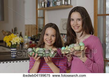 Girls with coloured Easter eggs for the Easter basket, Easter, Upper Bavaria, Bavaria, Germany, Europe View Large Photo Image Stock Photography - Girls with coloured Easter eggs for the Easter basket, Easter, Upper Bavaria, Bavaria, Germany, Europe. Fotosearch